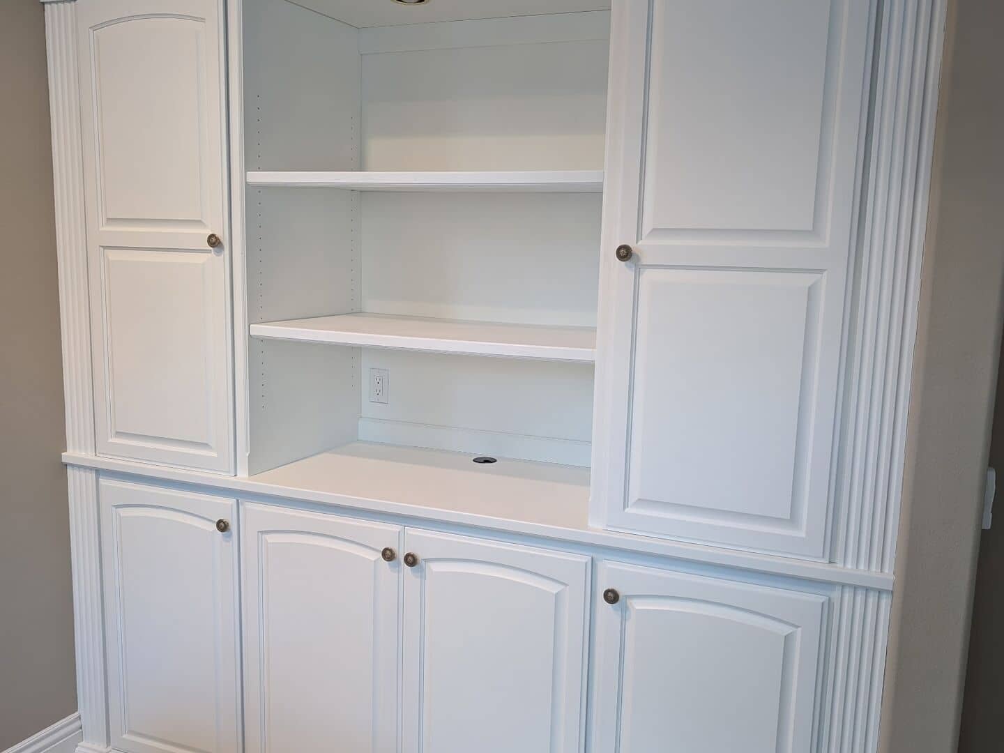 Built-in wall cabinet repainted in clean white