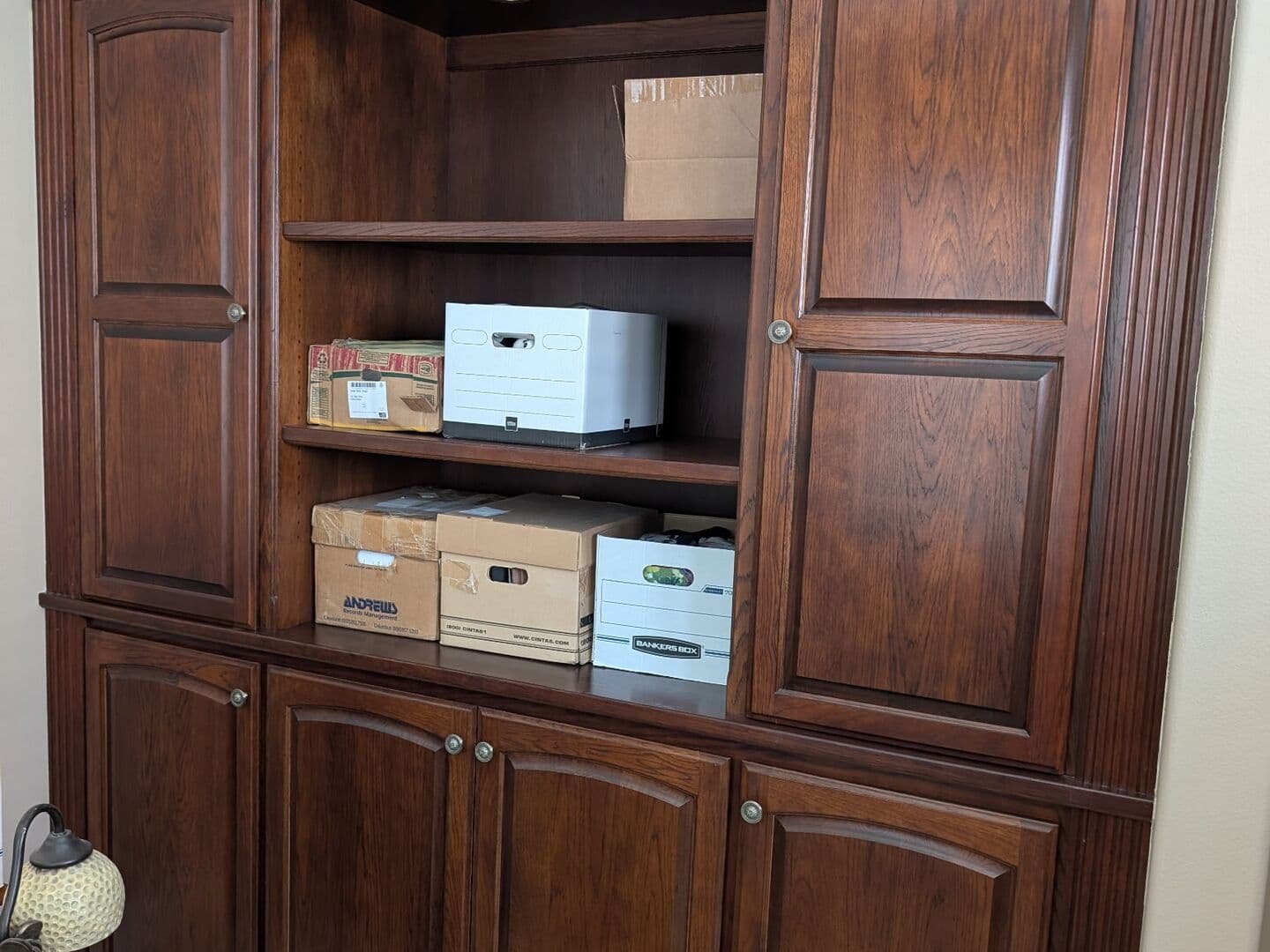 Before: dark stained built-in wall cabinet