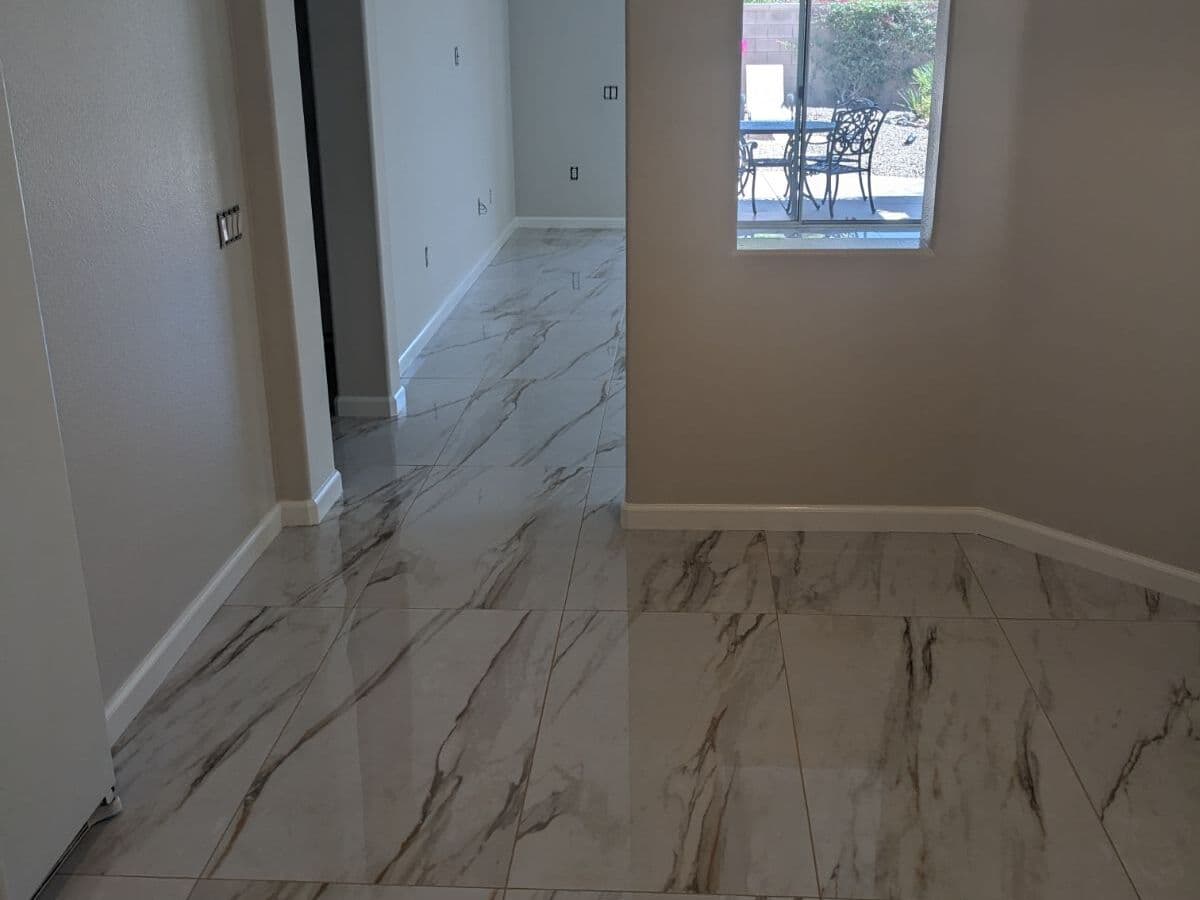 Polished marble-look porcelain floor in a bedroom