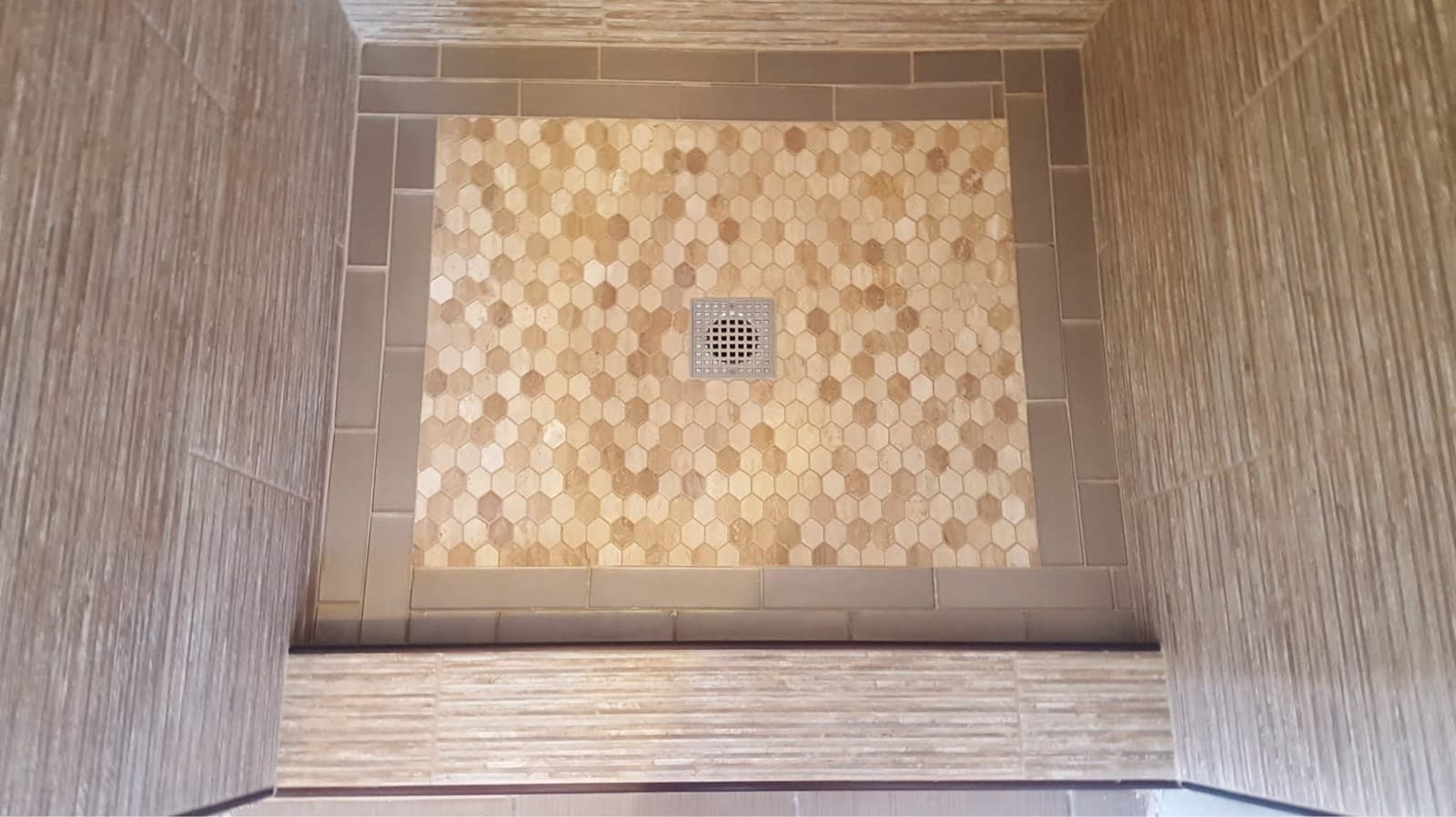 After: new waterproofed shower pan tiled in mosaic