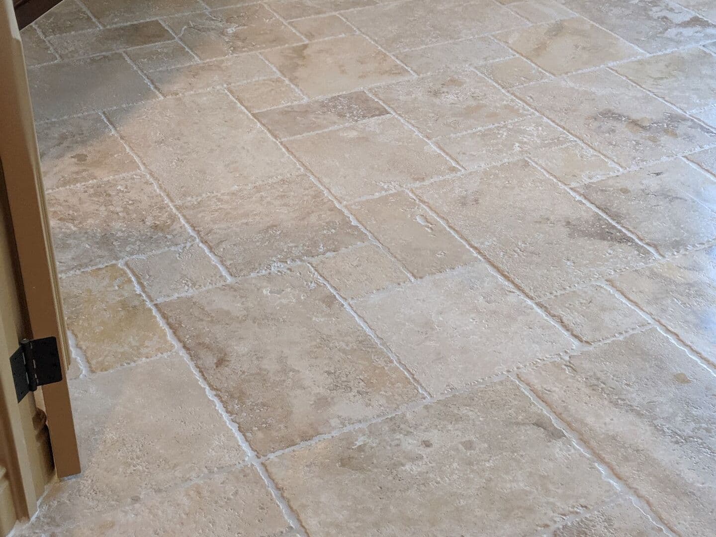 Travertine floor laid in a Versailles pattern
